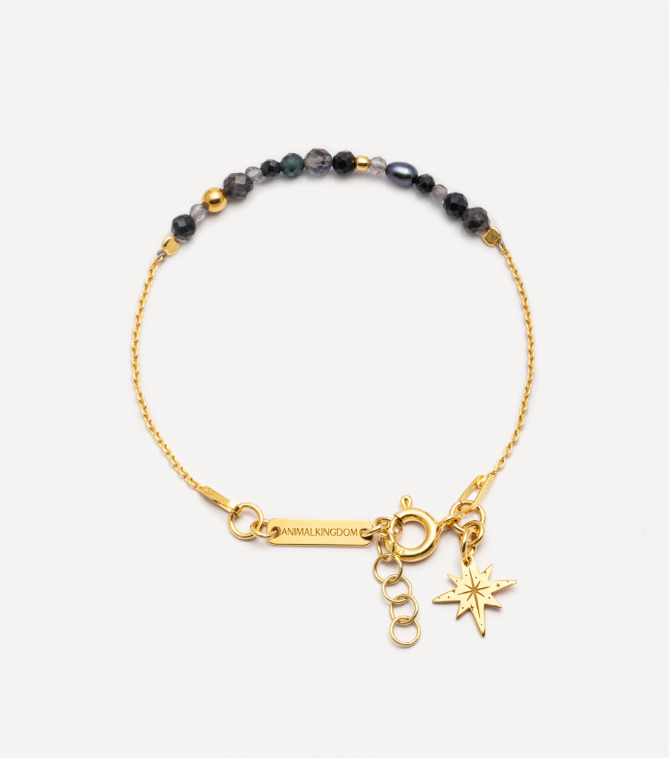 Pozłacana bransoletka z kamieniami i zawieszką