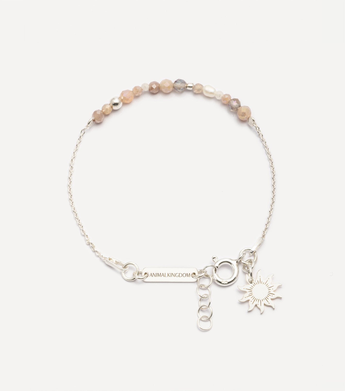 Srebrna bransoletka z kamieniami i zawieszką