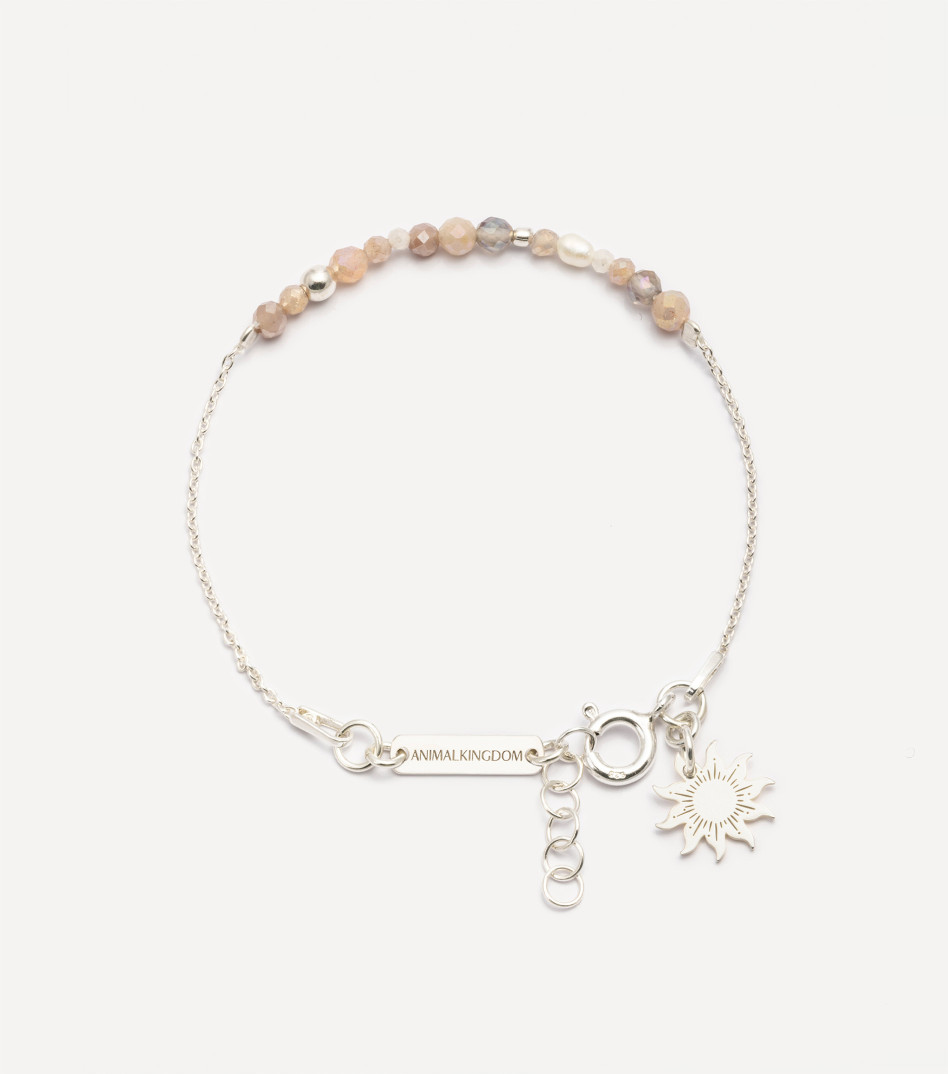 Srebrna bransoletka z kamieniami i zawieszką