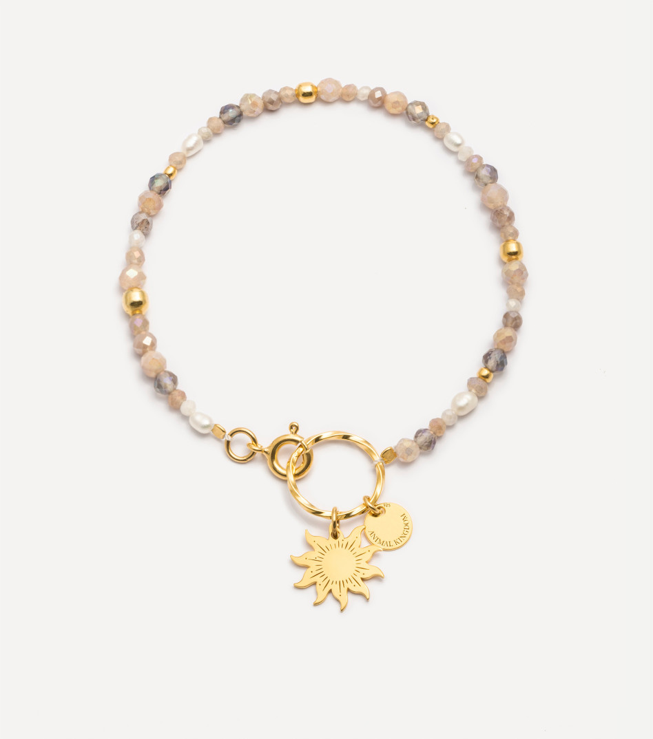 Pozłacana bransoletka z kamieniami i zawieszką