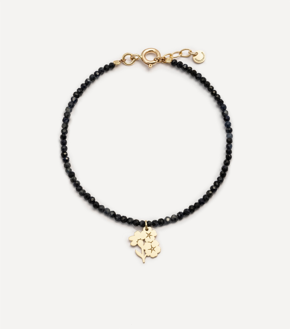 Złota bransoletka z kamieniami i zawieszką