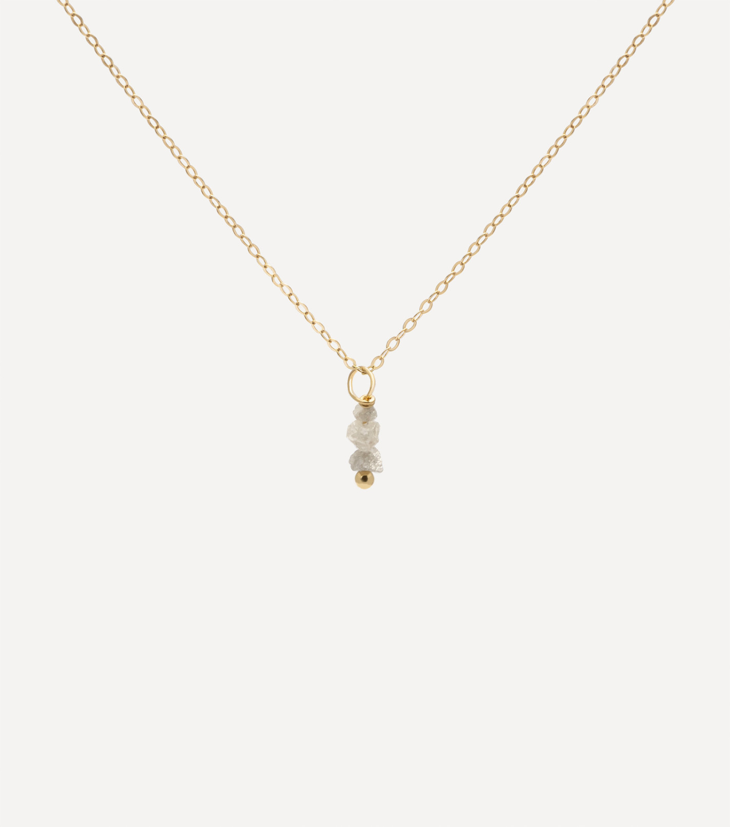 Złoty naszyjnik z zawieszką z surowych diamentów