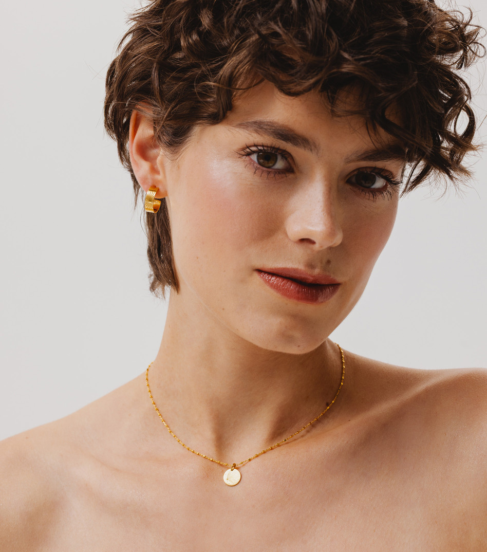 Pozłacane kolczyki koła z zimowym grawerem