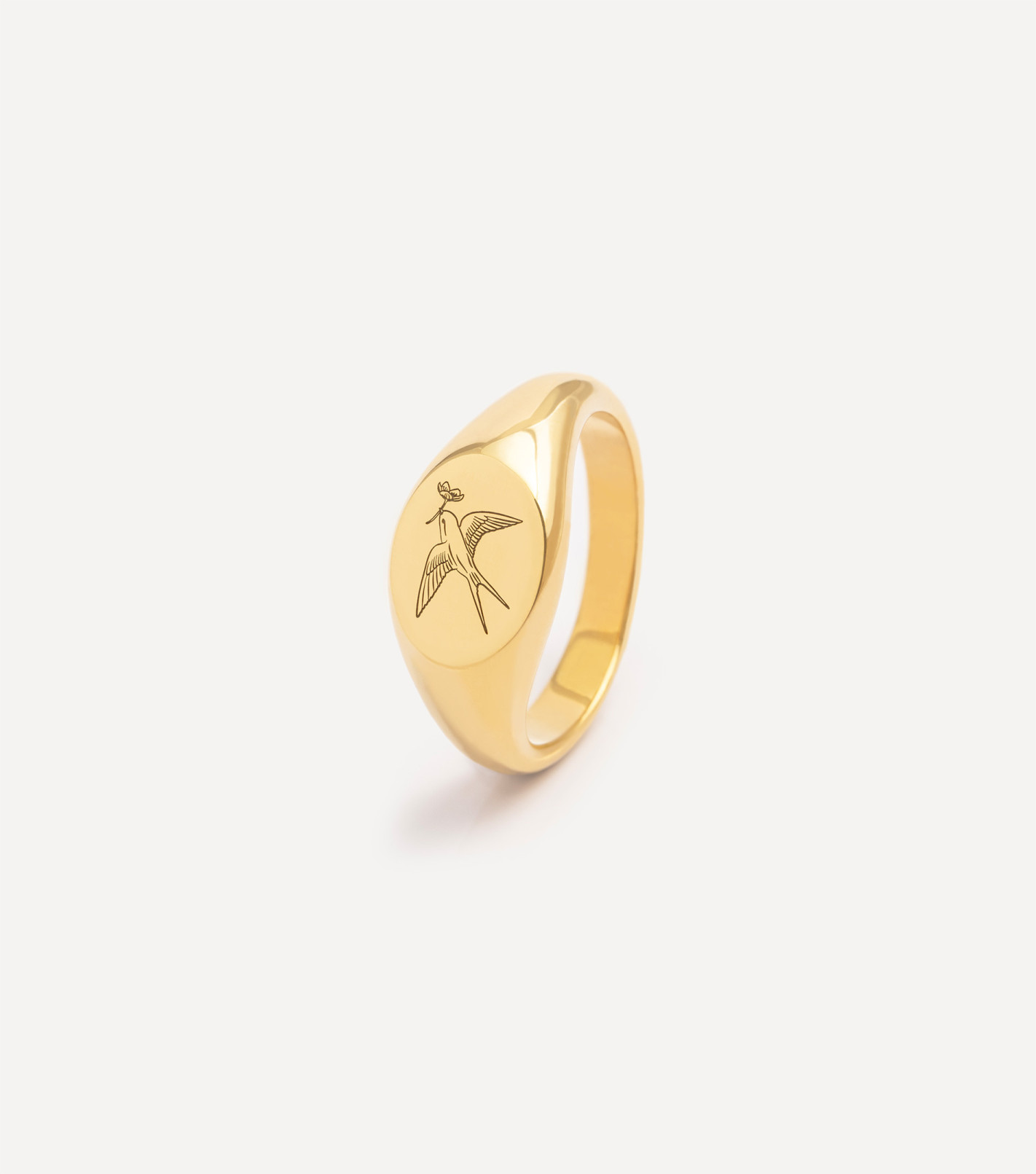 Pozłacany sygnet z jaskółką