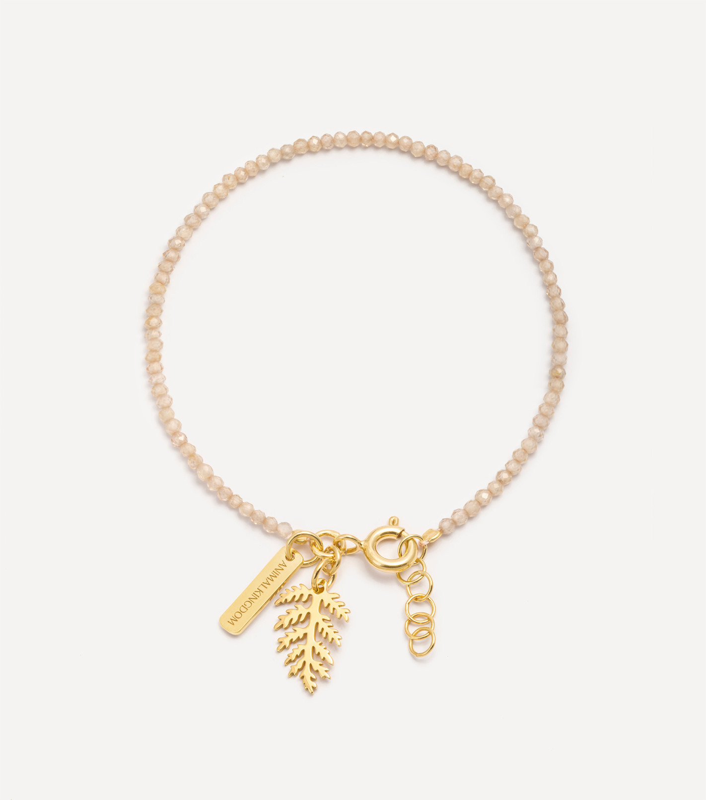 Pozłacana bransoletka z kamieniami i zawieszką