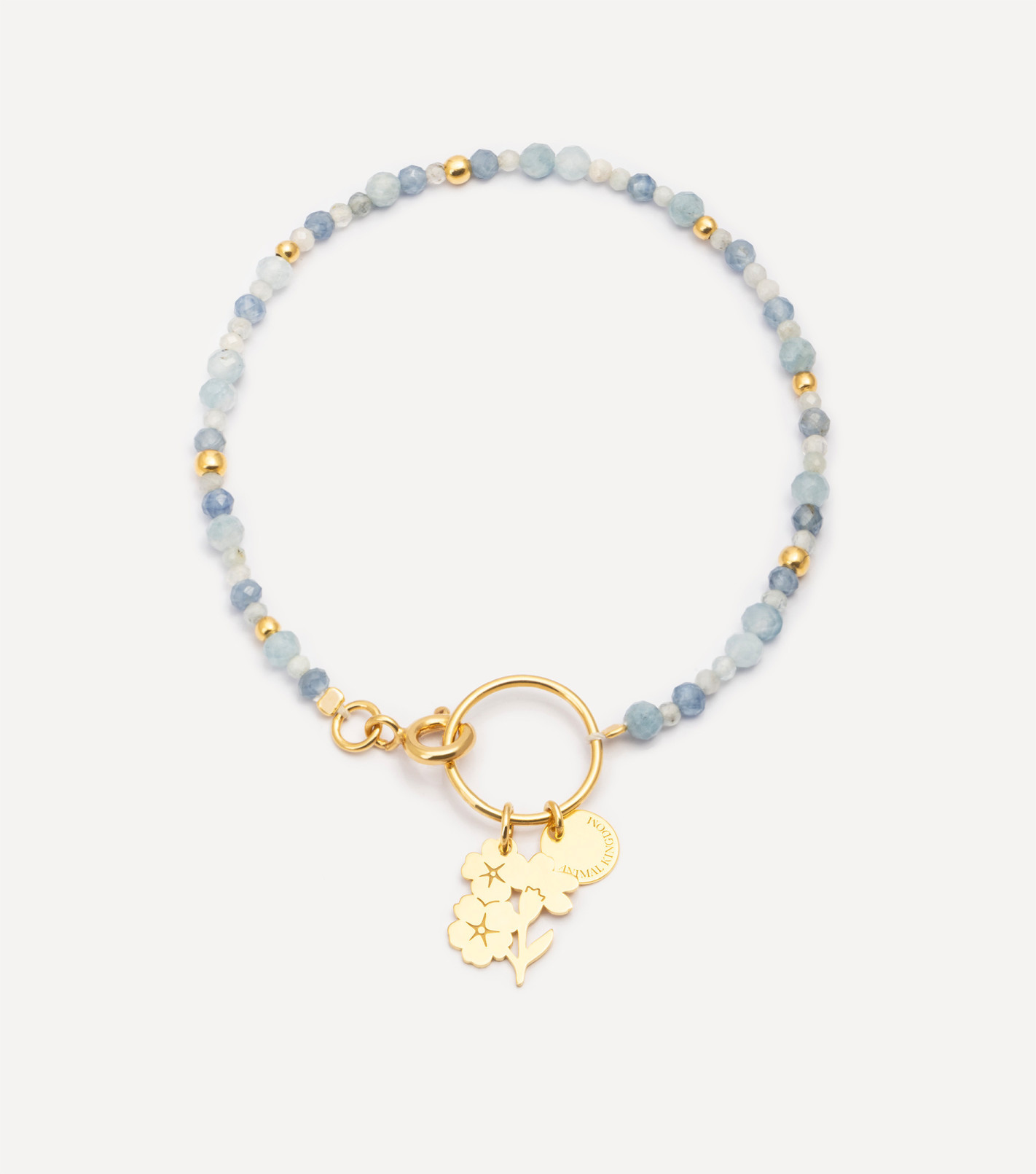 Pozłacana bransoletka z kamieniami i zawieszką